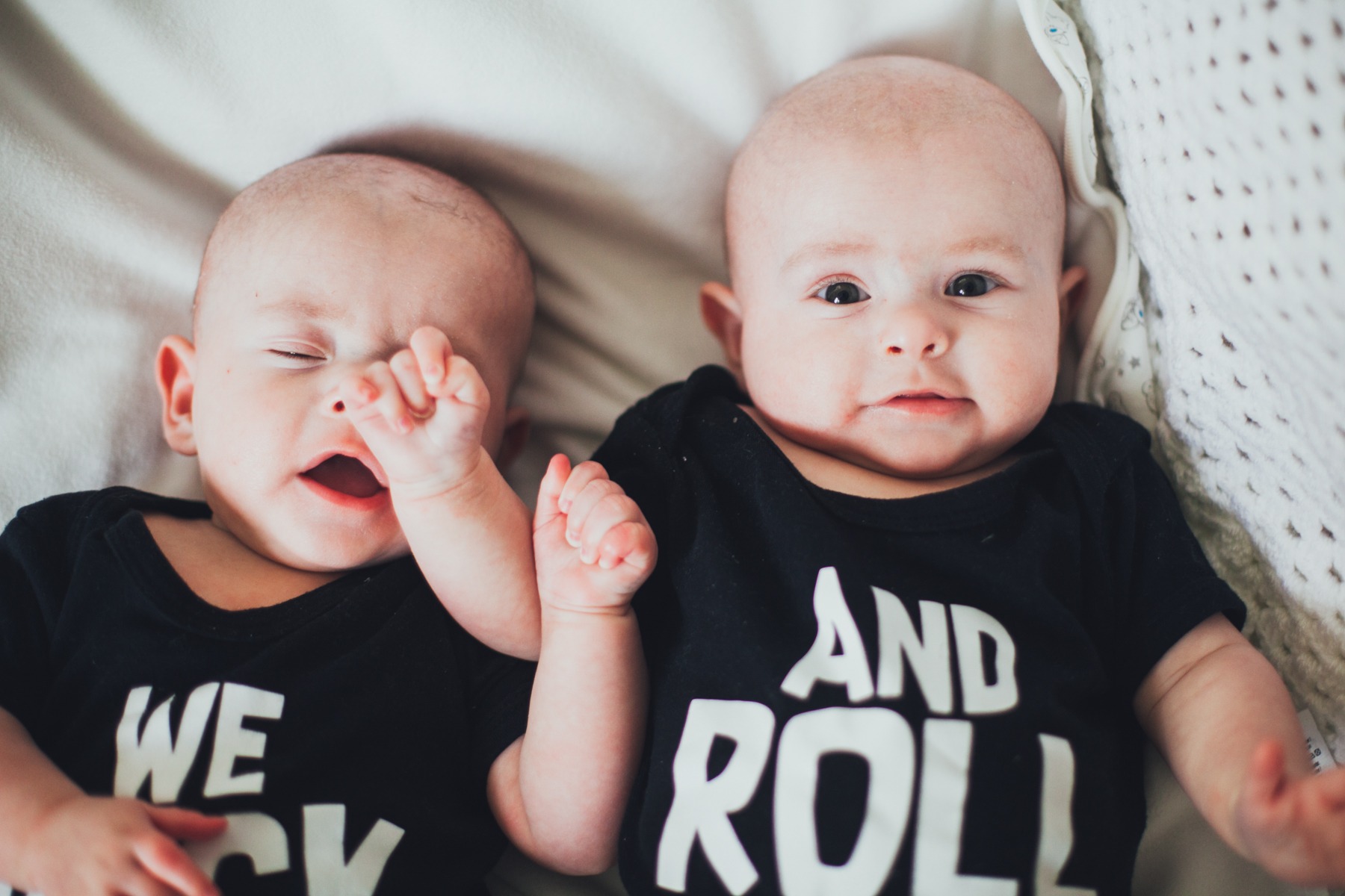 Photograph of baby accidentally punching his twin brother in the face.