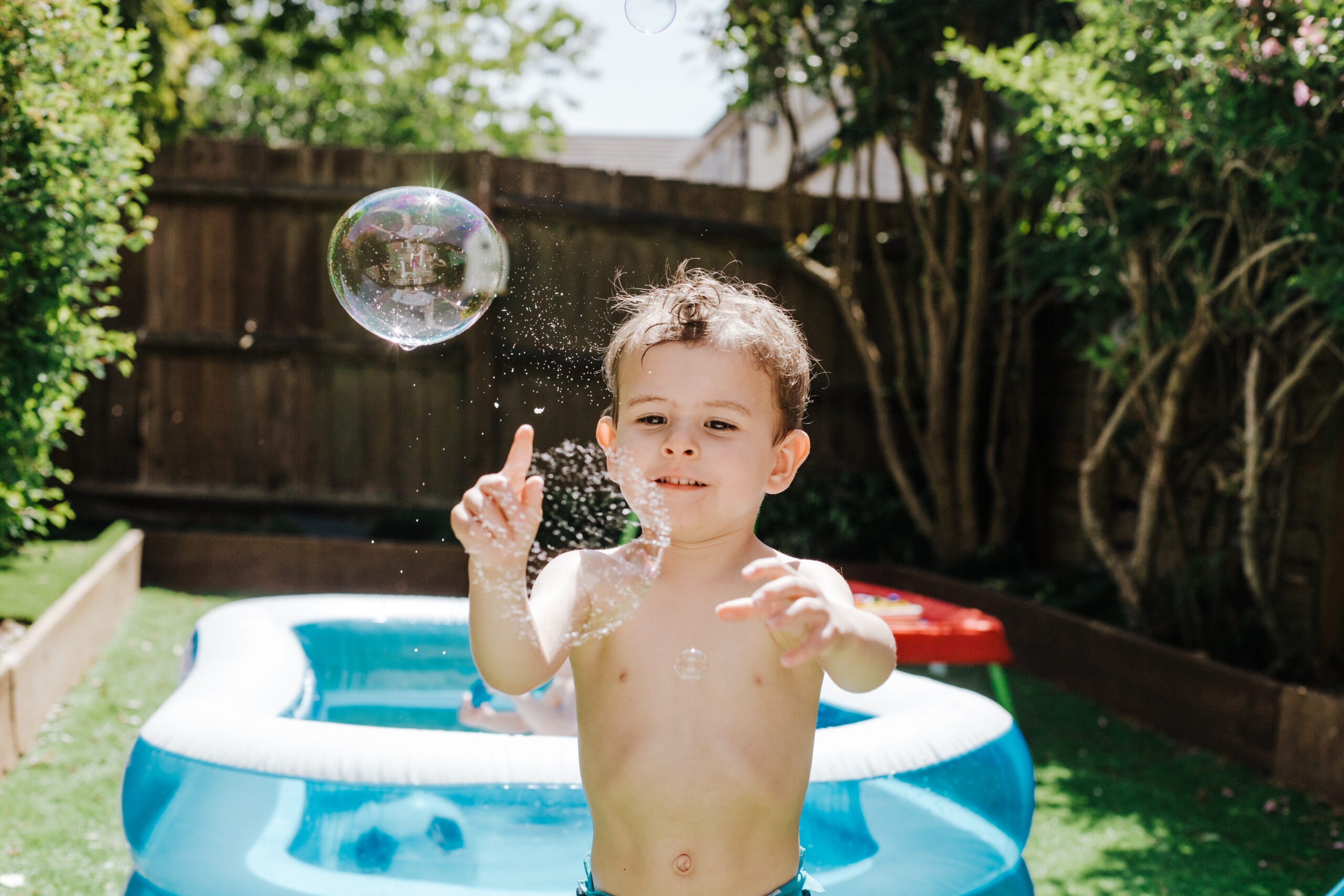 Picture of child bursting bubbles
