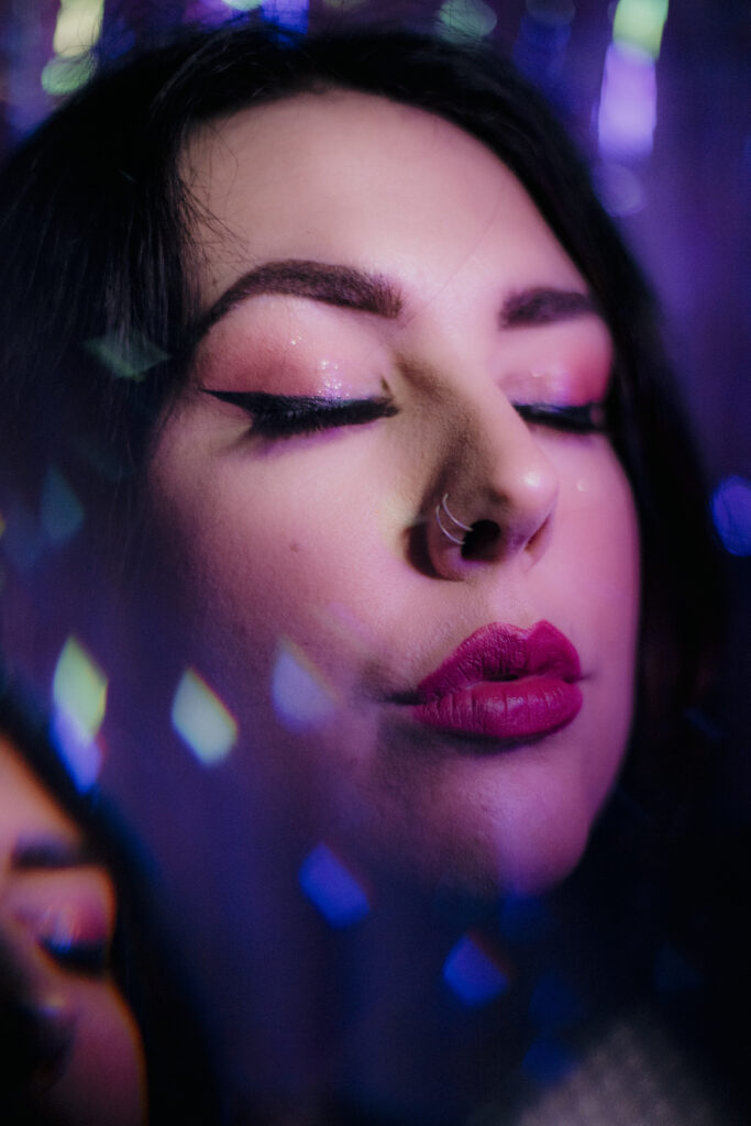 Portrait of a woman with prism effect and coloured gels.