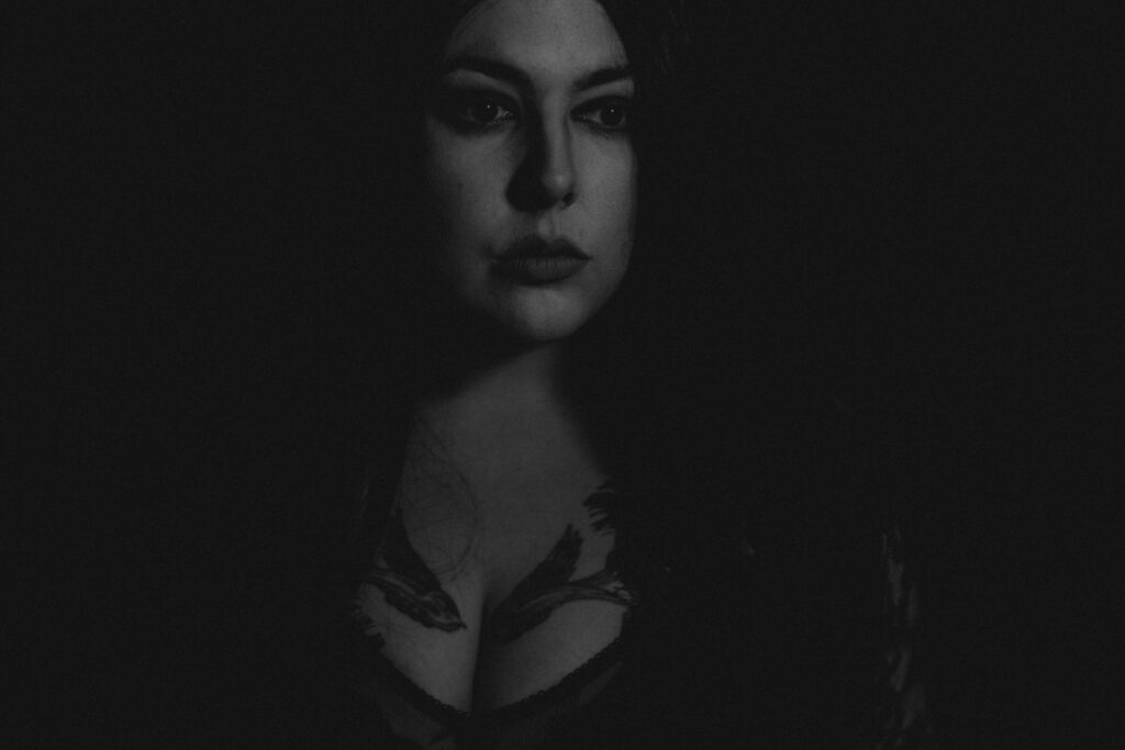 Black and white self portrait, dark and moody