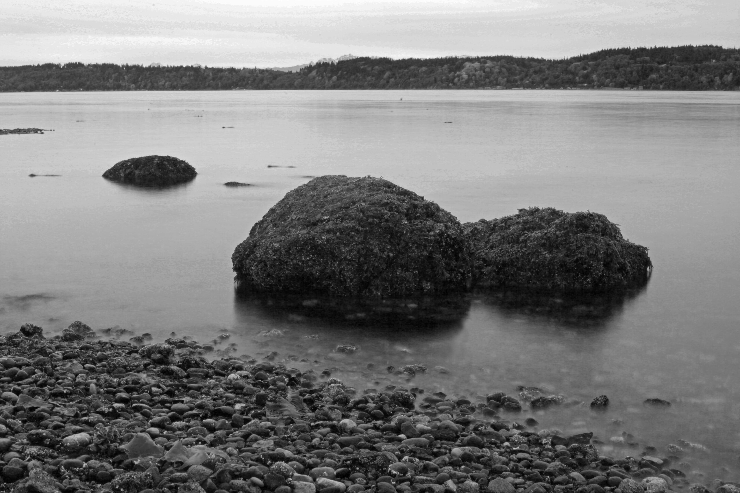 Long exposure black and white photograph of mukilteo beach