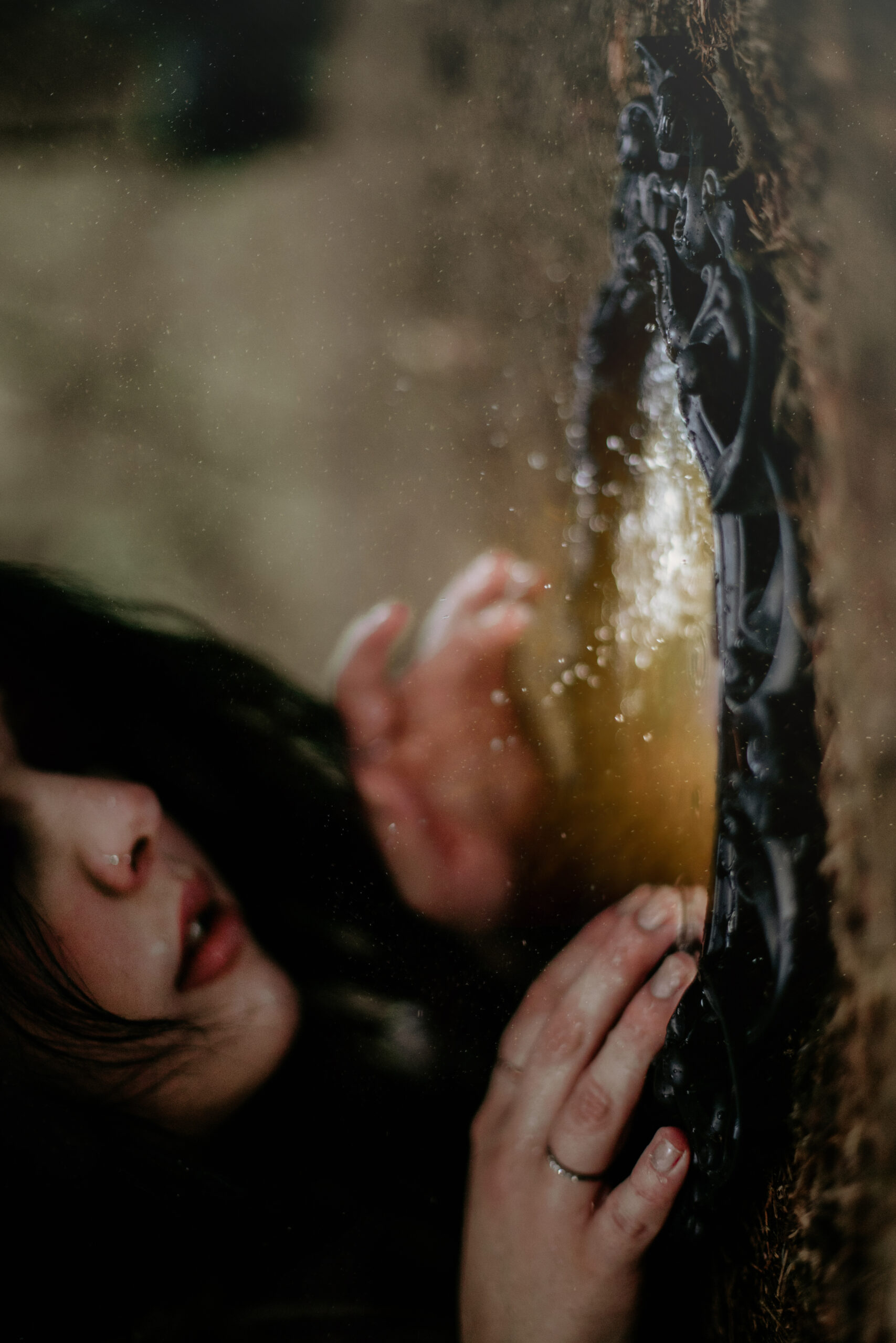 Mirror self portrait with water splashes