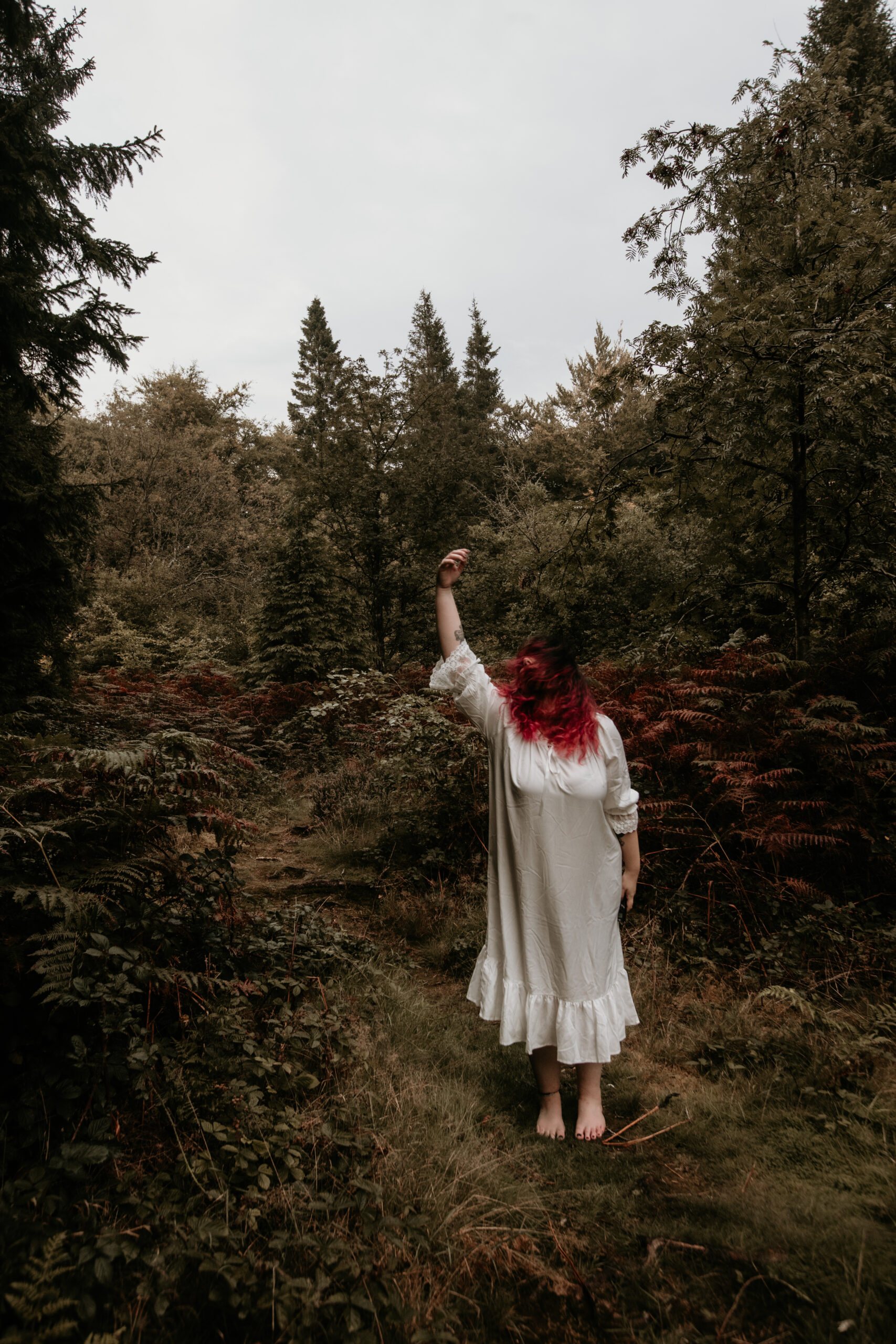  woman in woods with pink hair