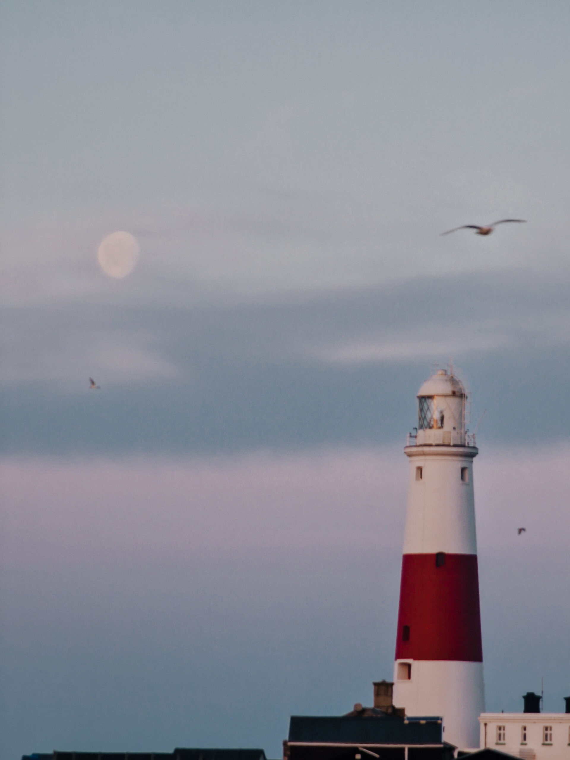 Portland bill at first light with moon in sky